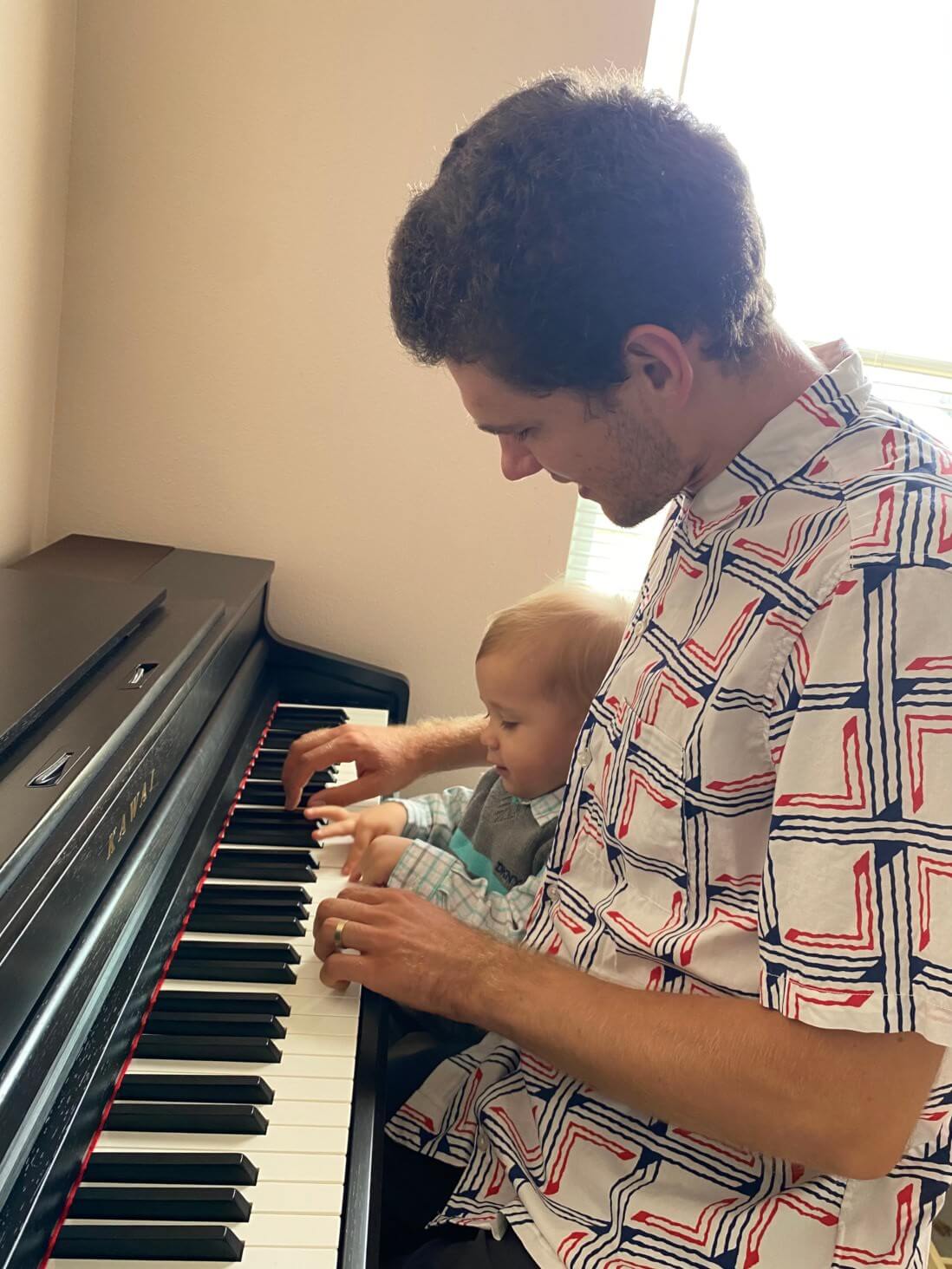 Piano teacher giving in-home lessons to a young beginner in Houston, Texas.